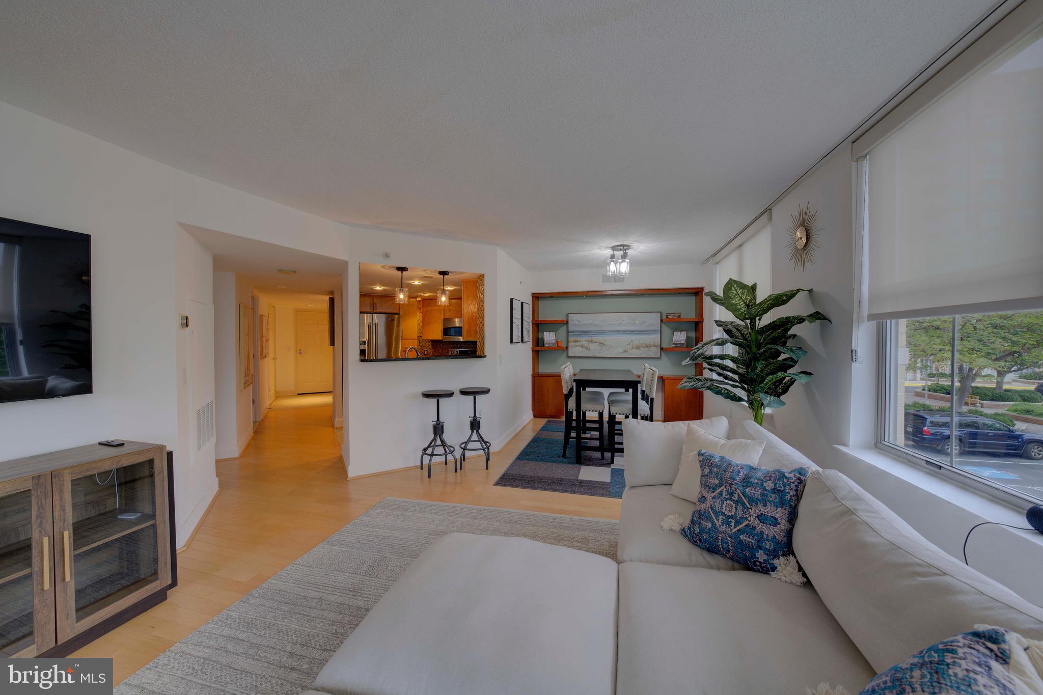 11800 Sunset Hills Road, Unit 222 Reston, VA 20190 - Photo 22 of 70 a living room with furniture and a flat screen tv