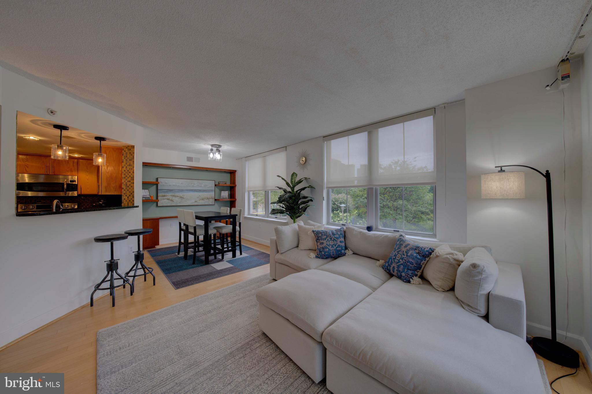 11800 Sunset Hills Road, Unit 222 Reston, VA 20190 - Photo 23 of 70 a living room with furniture and a flat screen tv