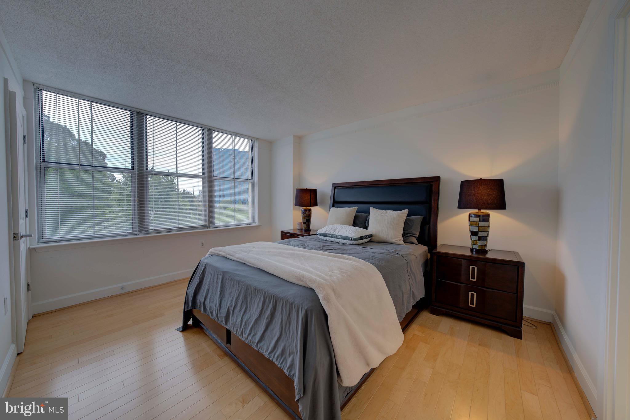 11800 Sunset Hills Road, Unit 222 Reston, VA 20190 - Photo 27 of 70 a bedroom with a bed and window