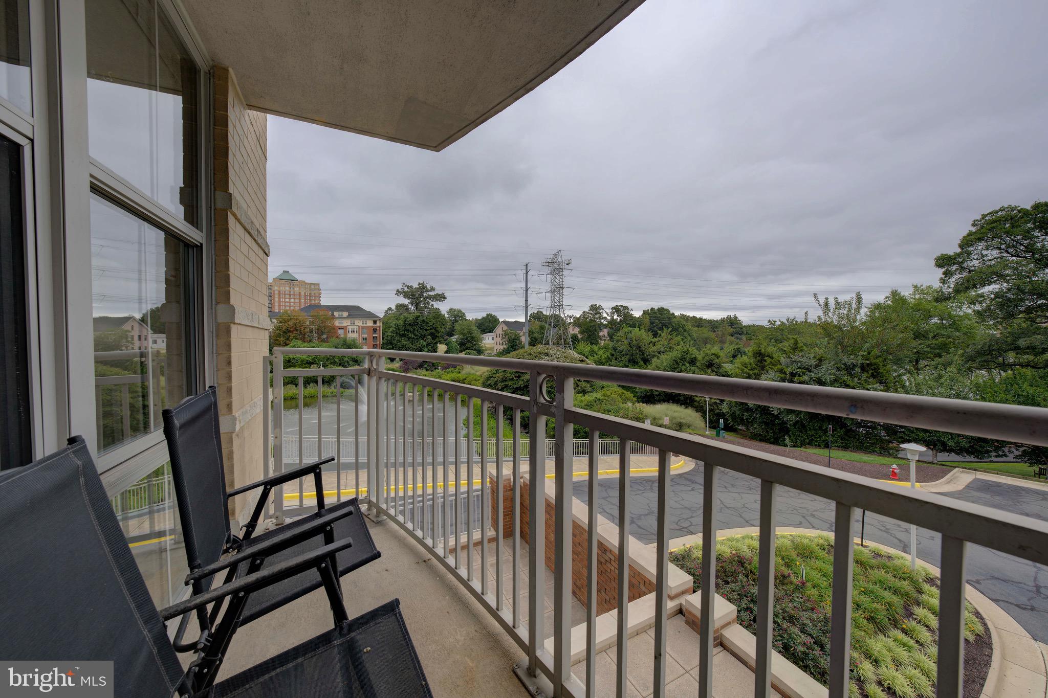 11800 Sunset Hills Road, Unit 222 Reston, VA 20190 - Photo 40 of 70 a view of a balcony with wooden floor and fence