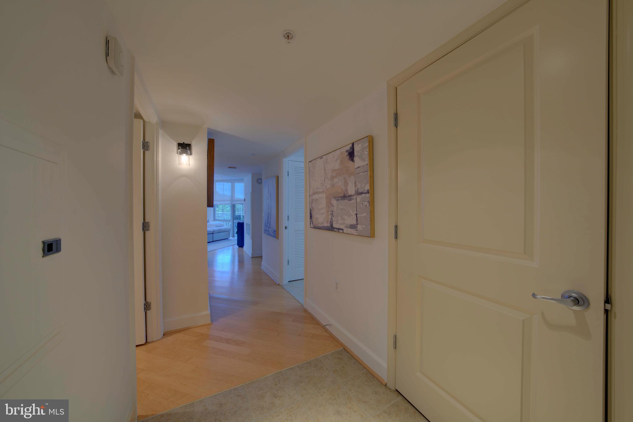 11800 Sunset Hills Road, Unit 222 Reston, VA 20190 - Photo 5 of 70 a view of a hallway with wooden floor