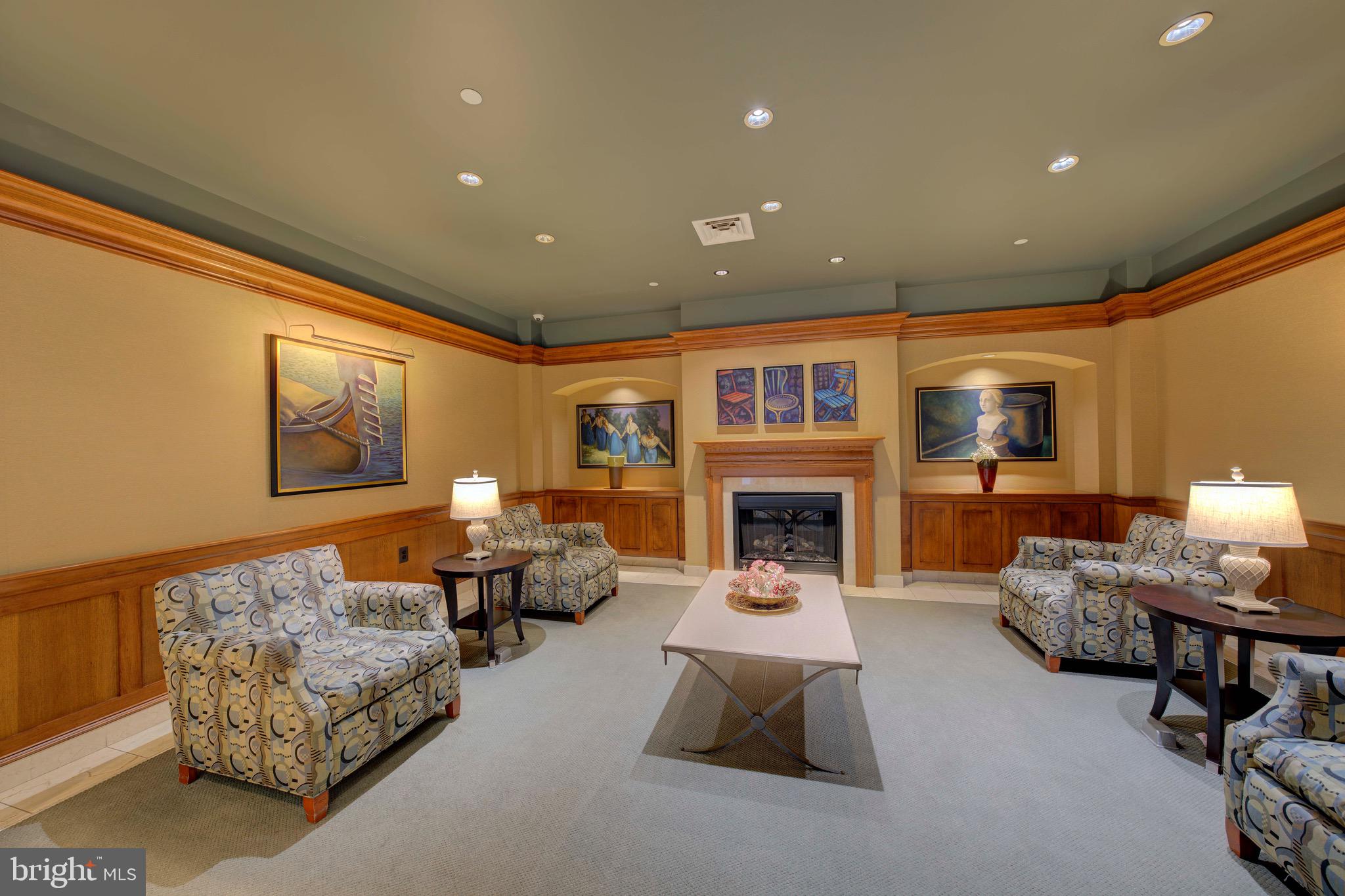 11800 Sunset Hills Road, Unit 222 Reston, VA 20190 - Photo 54 of 70 a living room with furniture and a fireplace