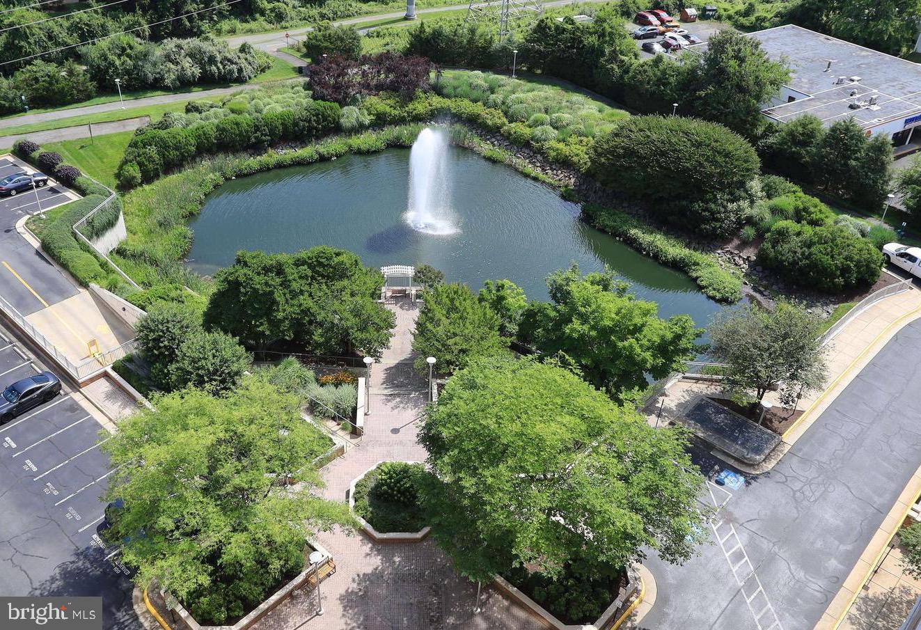 11800 Sunset Hills Road, Unit 222 Reston, VA 20190 - Photo 64 of 70 an aerial view of a house with a yard and lake view