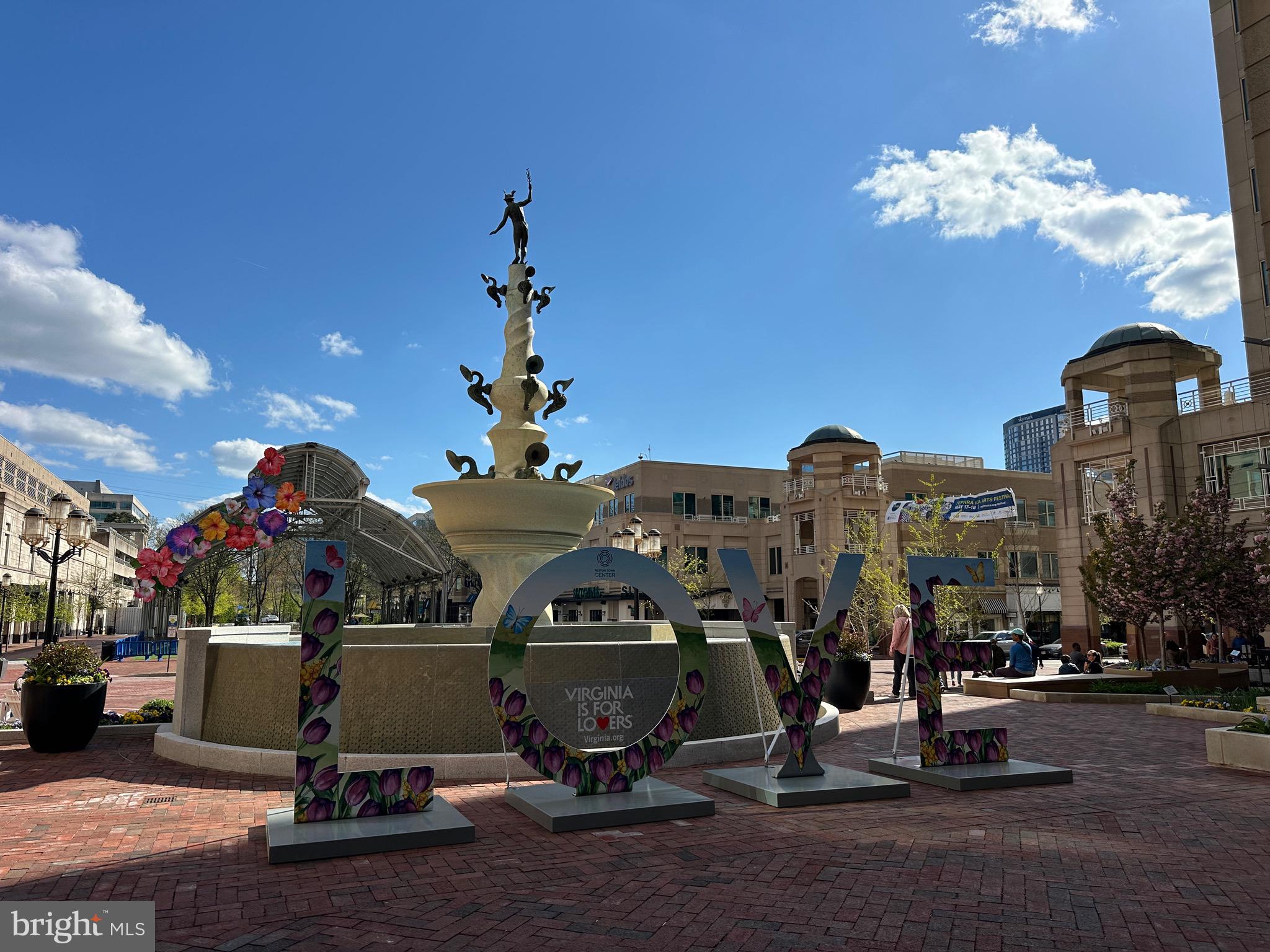 11800 Sunset Hills Road, Unit 222 Reston, VA 20190 - Photo 70 of 70 a front view of a building with a garden