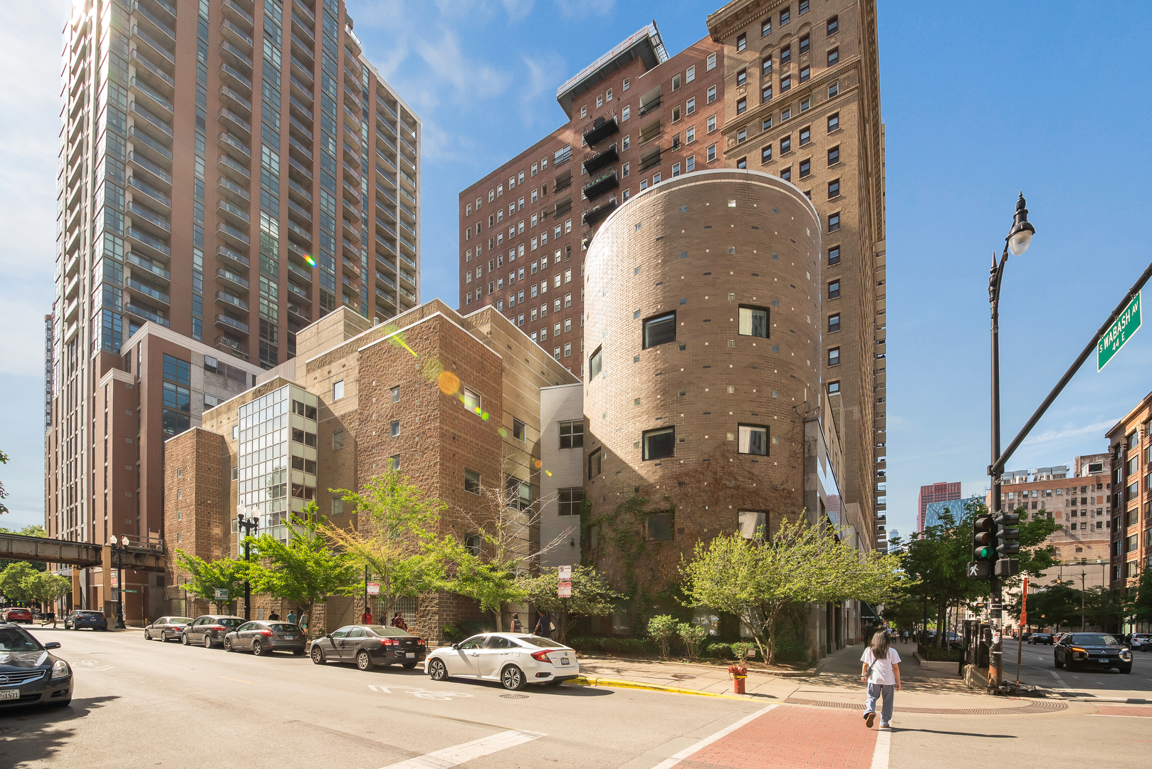 a couple of cars parked in front of brick building