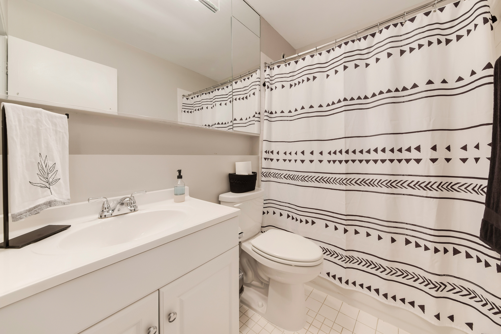 40 East 9th Street, Unit 715 Chicago, IL 60605 - Photo 12 of 19 a bathroom with a sink a toilet and a mirror