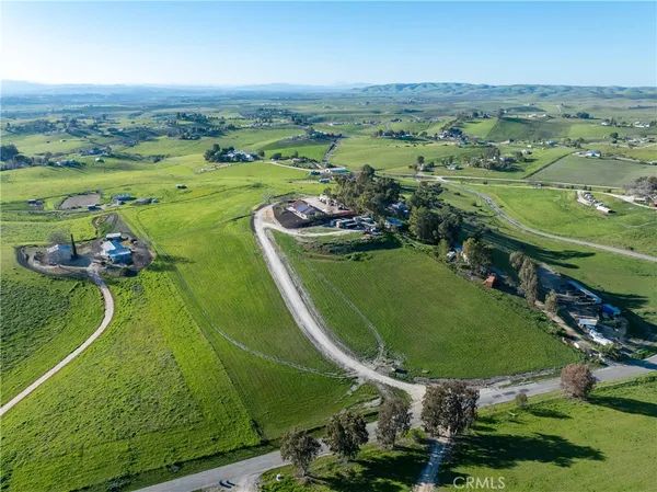 an aerial view of a golf course with chairs