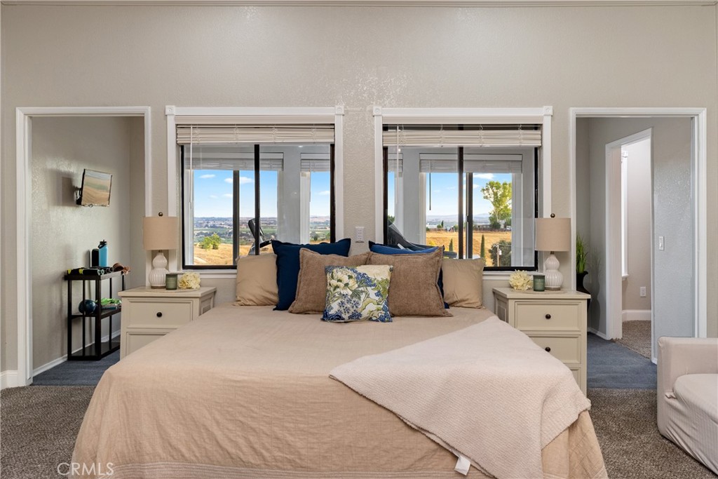 2245 Rancho Lomas Way San Miguel, CA 93451 - Photo 12 of 52 a large bedroom with a bed and a large mirror