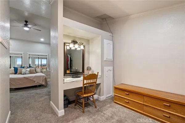 a room with a couch and a view of living room