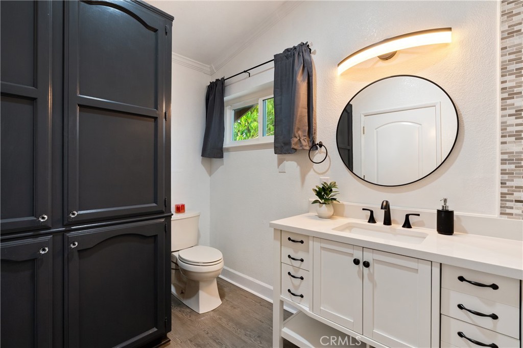 2245 Rancho Lomas Way San Miguel, CA 93451 - Photo 16 of 52 a bathroom with a granite countertop toilet sink and mirror