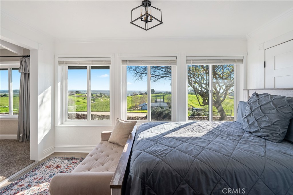 2245 Rancho Lomas Way San Miguel, CA 93451 - Photo 21 of 52 a bedroom with a bed and a couch