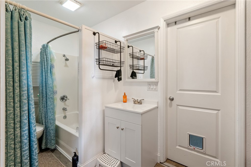 2245 Rancho Lomas Way San Miguel, CA 93451 - Photo 26 of 52 a bathroom with a shower sink and mirror