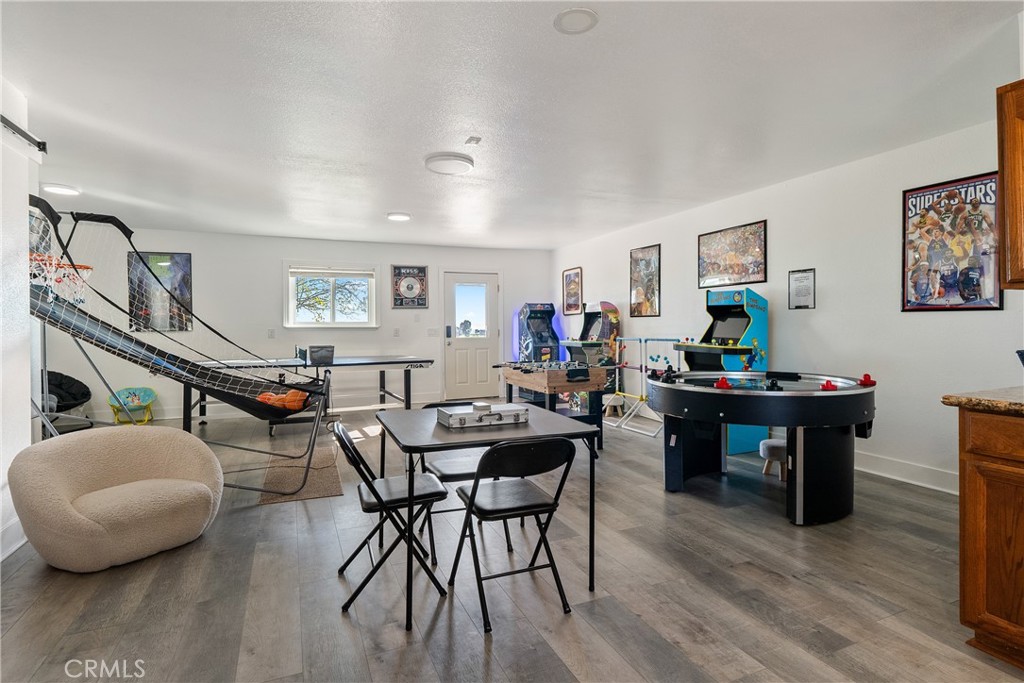 2245 Rancho Lomas Way San Miguel, CA 93451 - Photo 30 of 52 a view of a dining room with furniture and wooden floor