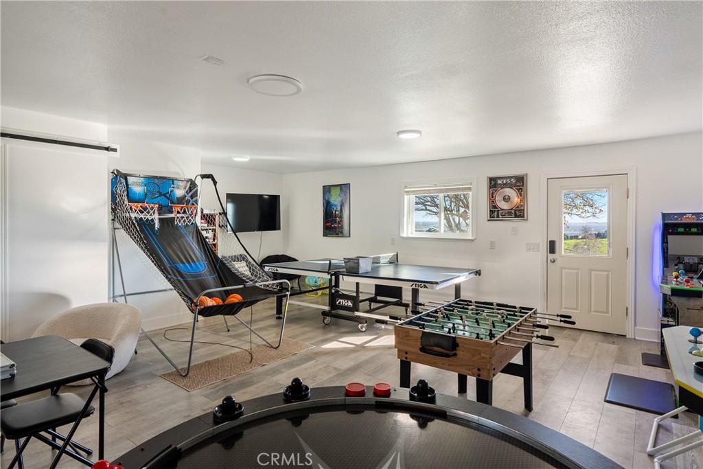 2245 Rancho Lomas Way San Miguel, CA 93451 - Photo 31 of 52 a living room with furniture a air conditioner and a window
