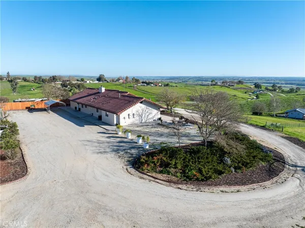 an aerial view of a house with a garden