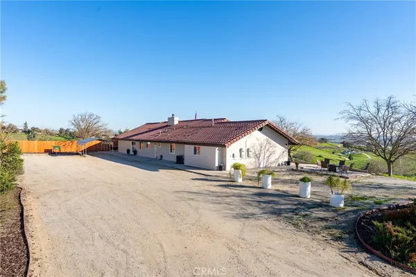 a house with trees in the background