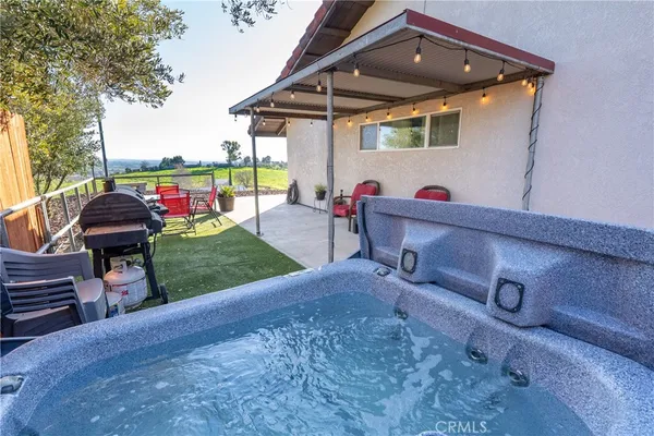 swimming pool view with a seating space