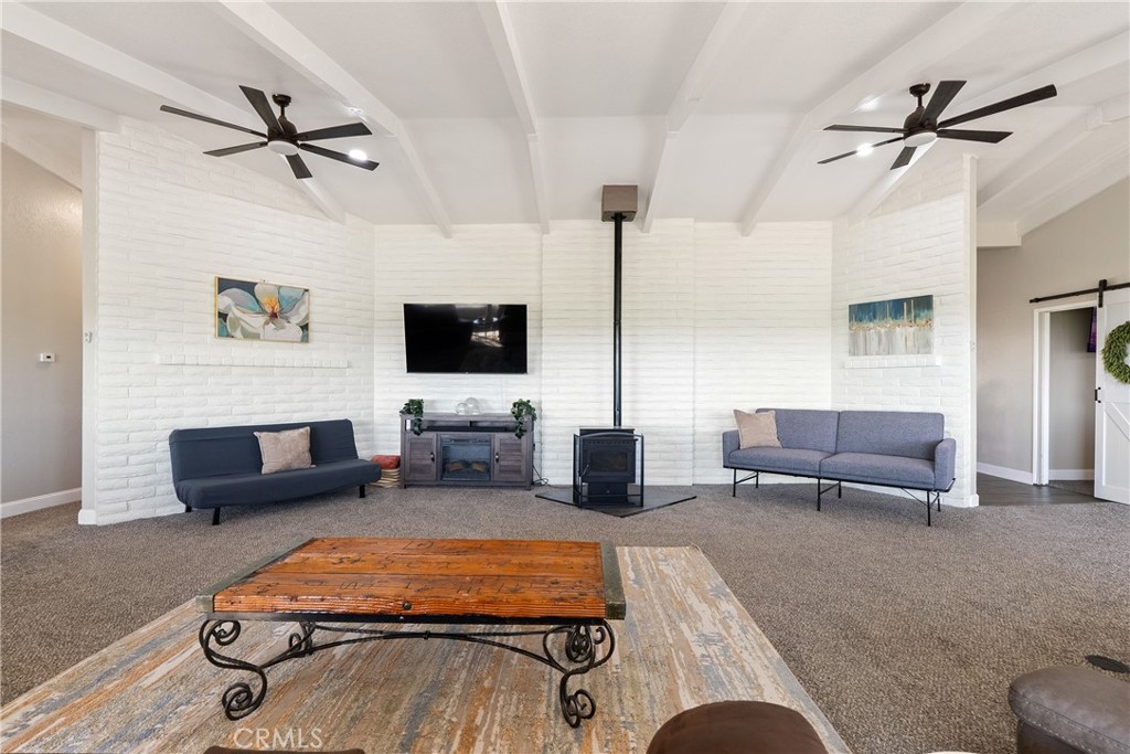 2245 Rancho Lomas Way San Miguel, CA 93451 - Photo 4 of 52 a living room with furniture and a flat screen tv