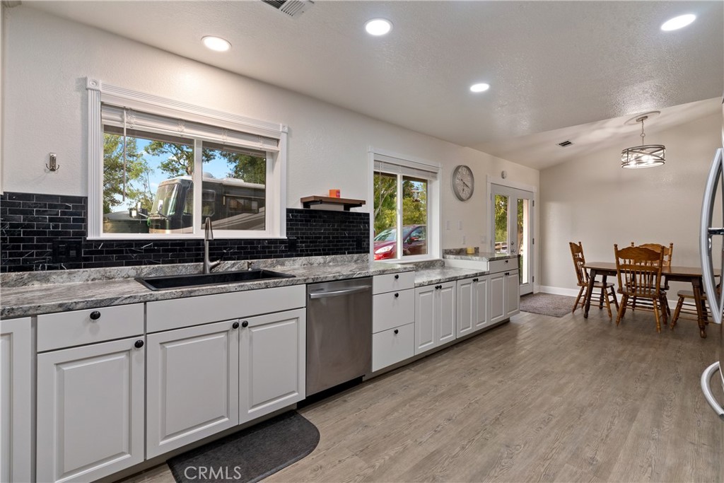 2245 Rancho Lomas Way San Miguel, CA 93451 - Photo 8 of 52 a large white kitchen with a large window