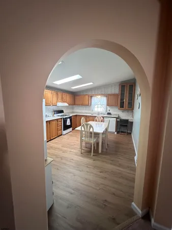 a view of a dining room with furniture and a table