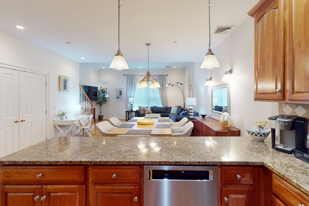 2 Harvard Square, Unit 2FURNISHED Brookline, MA 02445 - Photo 6 of 21 a kitchen with granite countertop a sink a counter space appliances and cabinets