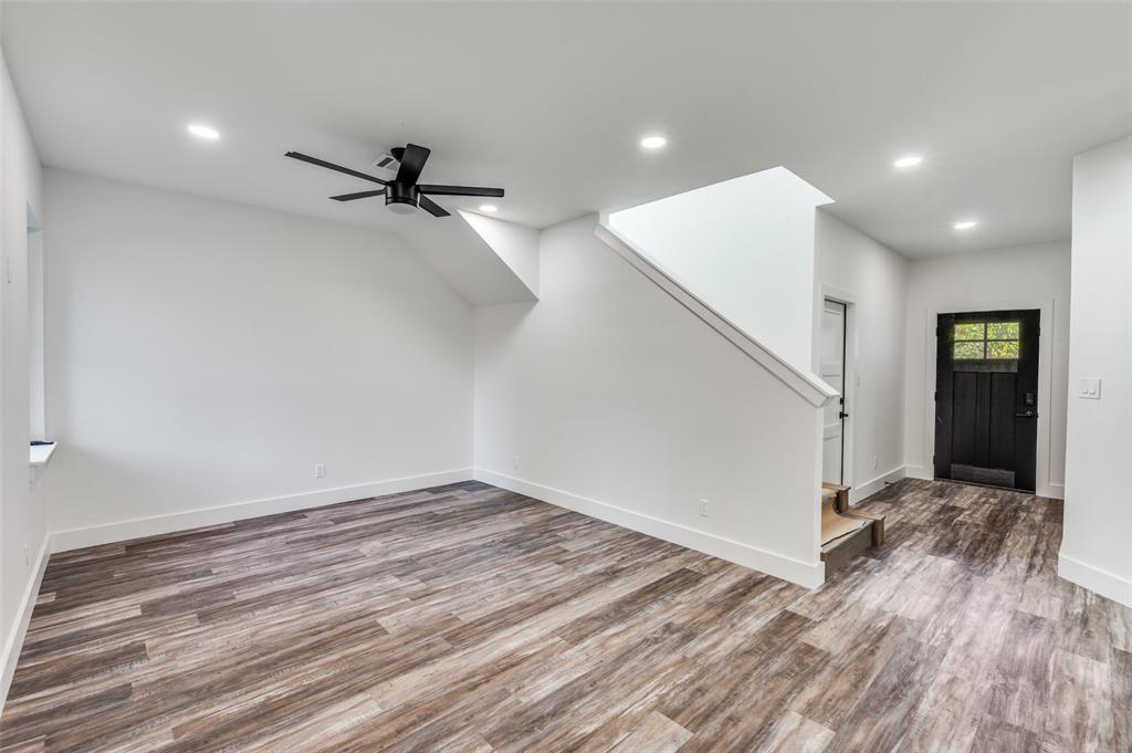 1013 Murphy Street Gainesville, TX 76240 - Photo 3 of 22 wooden floor in an empty room with a window