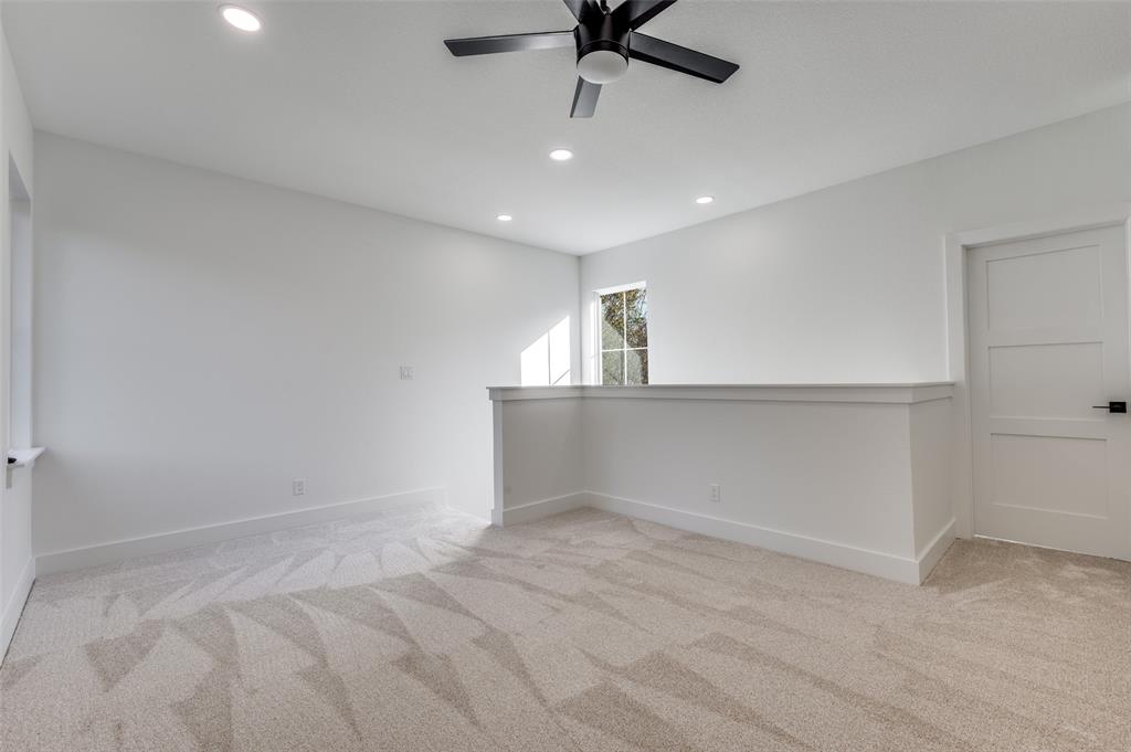 1013 Murphy Street Gainesville, TX 76240 - Photo 10 of 22 an empty room with a ceiling fan and window