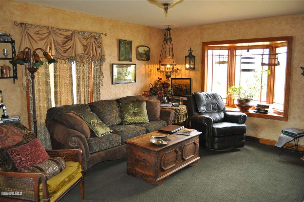 10099 East Chelsea Road Stockton, IL 61085 - Photo 6 of 40 a living room with furniture and a large window