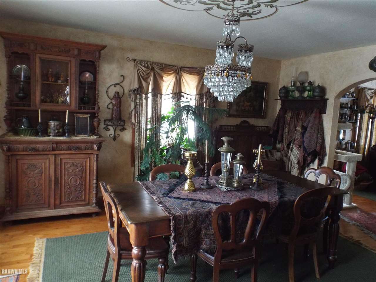 10099 East Chelsea Road Stockton, IL 61085 - Photo 9 of 40 a view of a dining room with furniture window and wooden floor