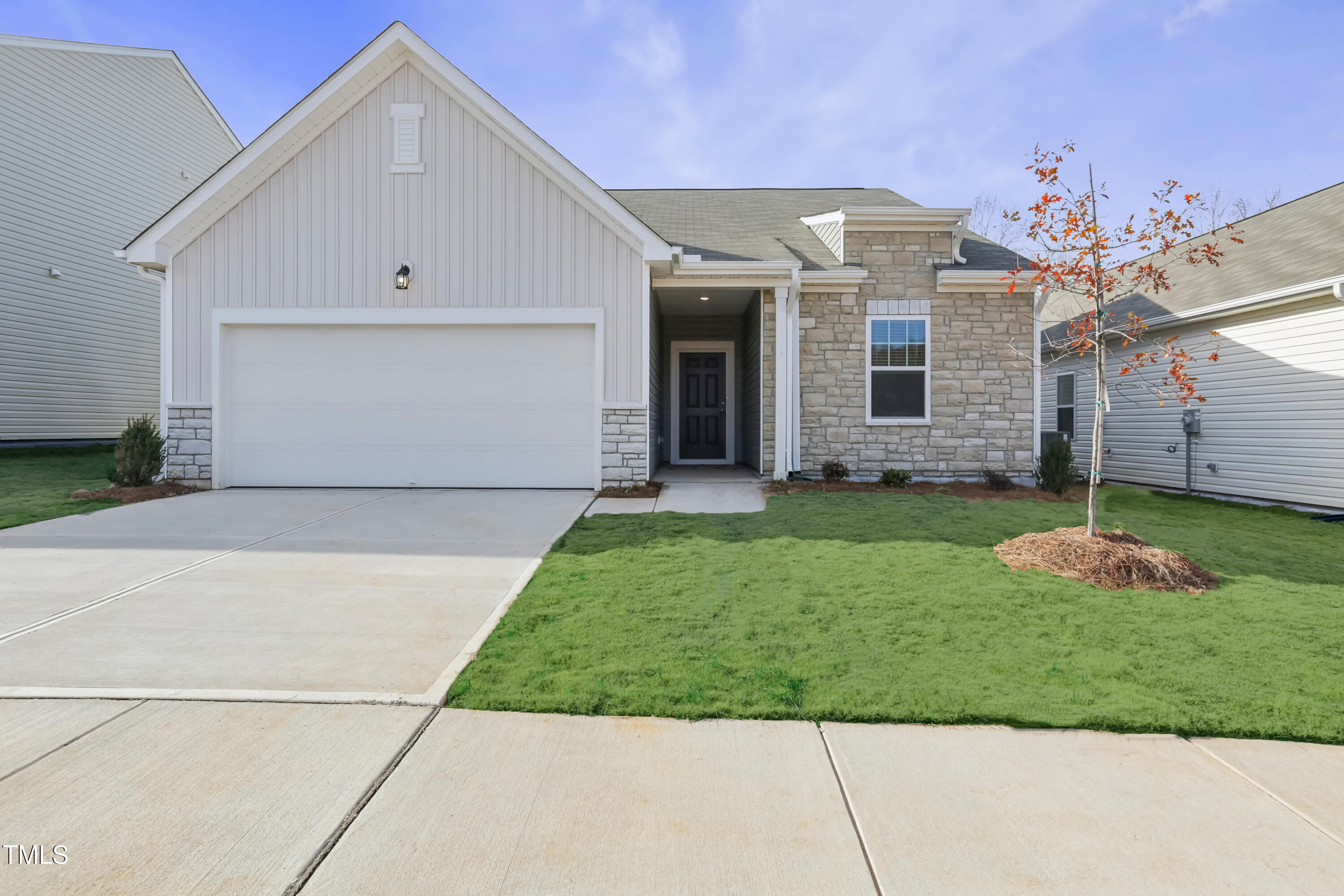 137 Gladstone Loop Clayton, NC 27520 - Photo 1 of 35 a front view of a house with a garden