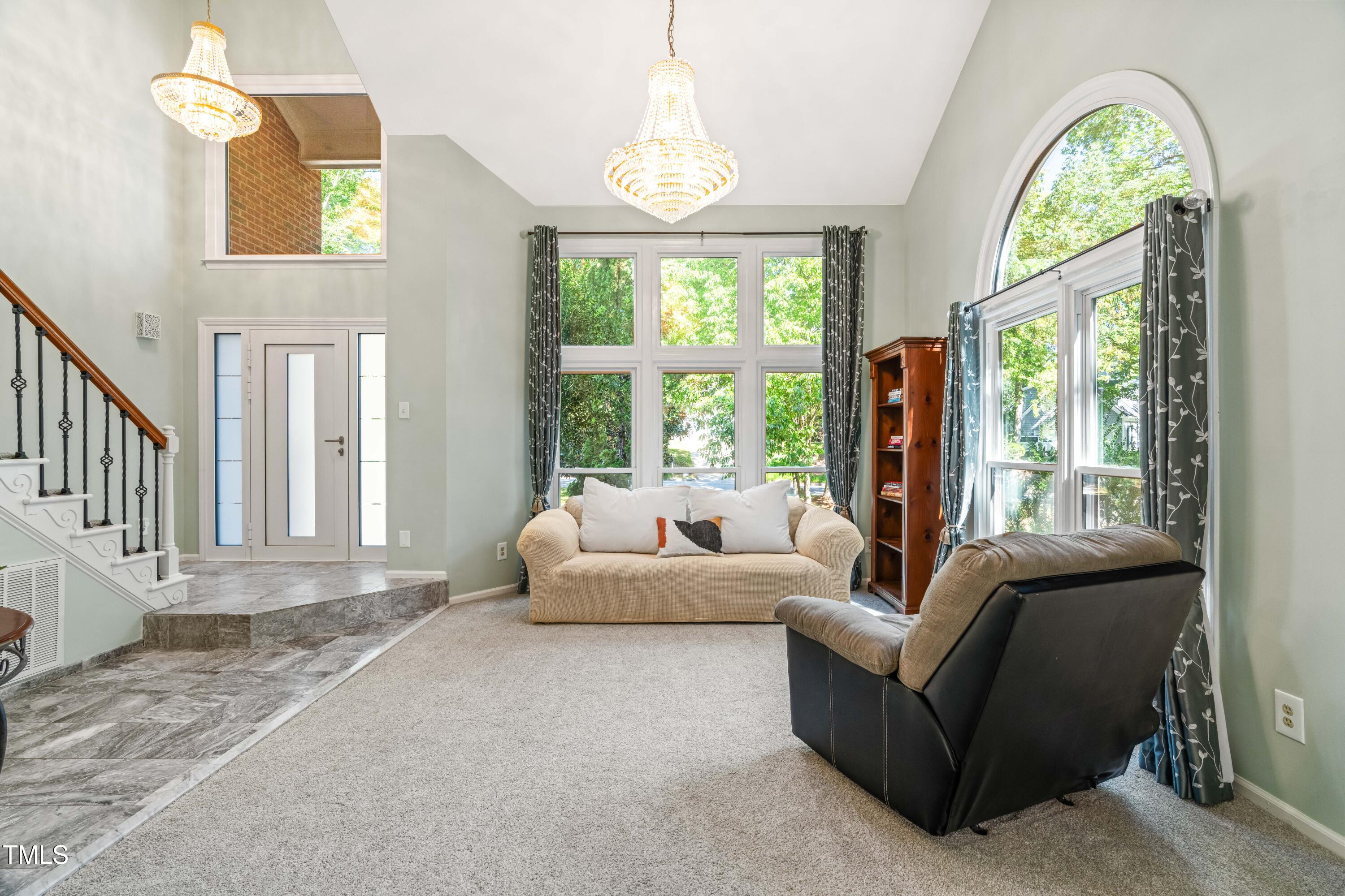 1106 Wellstone Circle Apex, NC 27502 - Photo 12 of 67 a living room with furniture and a large window