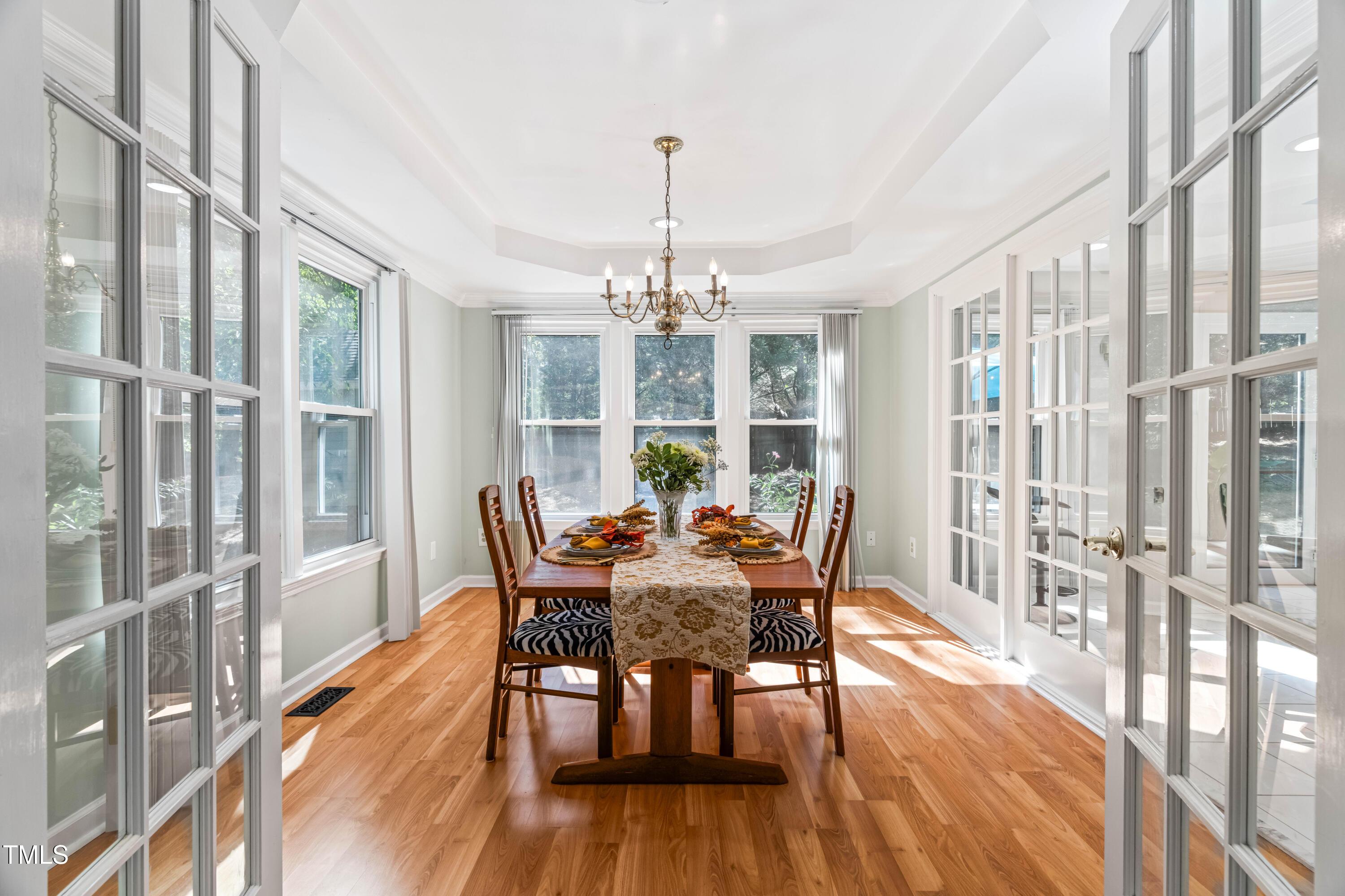 1106 Wellstone Circle Apex, NC 27502 - Photo 15 of 67 a view of a dining room with furniture window and wooden floor