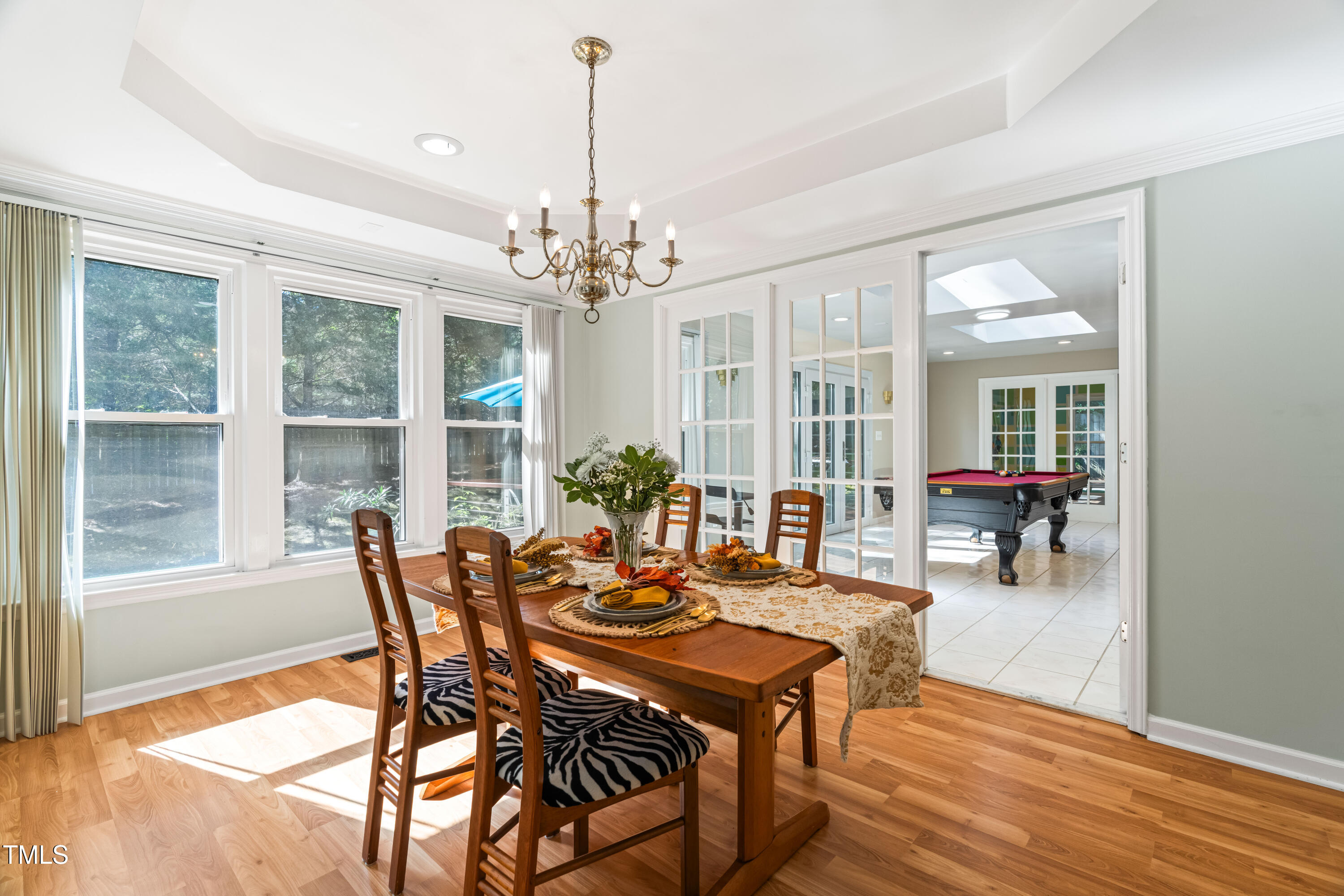 1106 Wellstone Circle Apex, NC 27502 - Photo 17 of 67 a view of a dining room with furniture wooden floor and chandelier