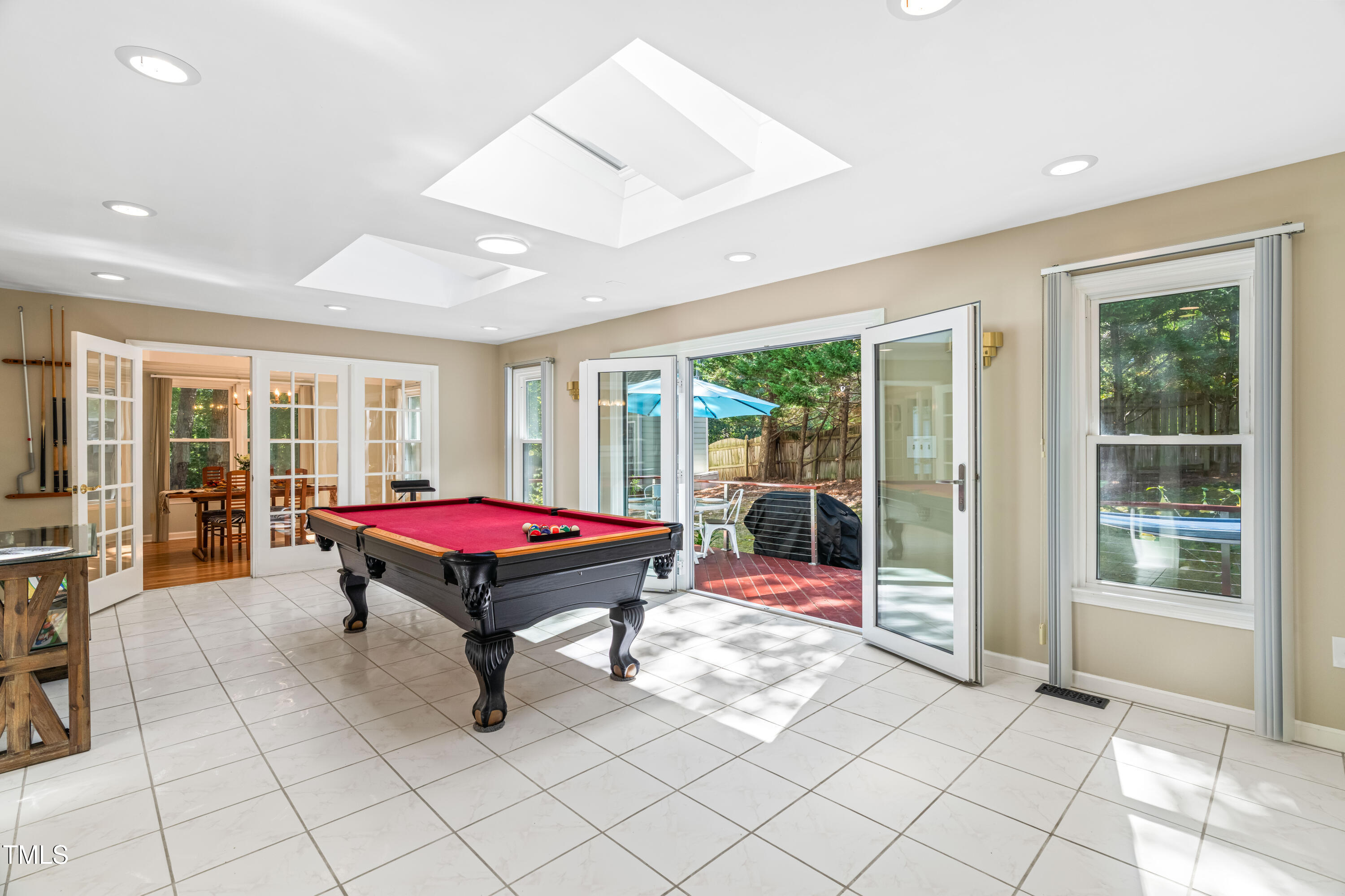 1106 Wellstone Circle Apex, NC 27502 - Photo 19 of 67 a room with pool table and glass windows