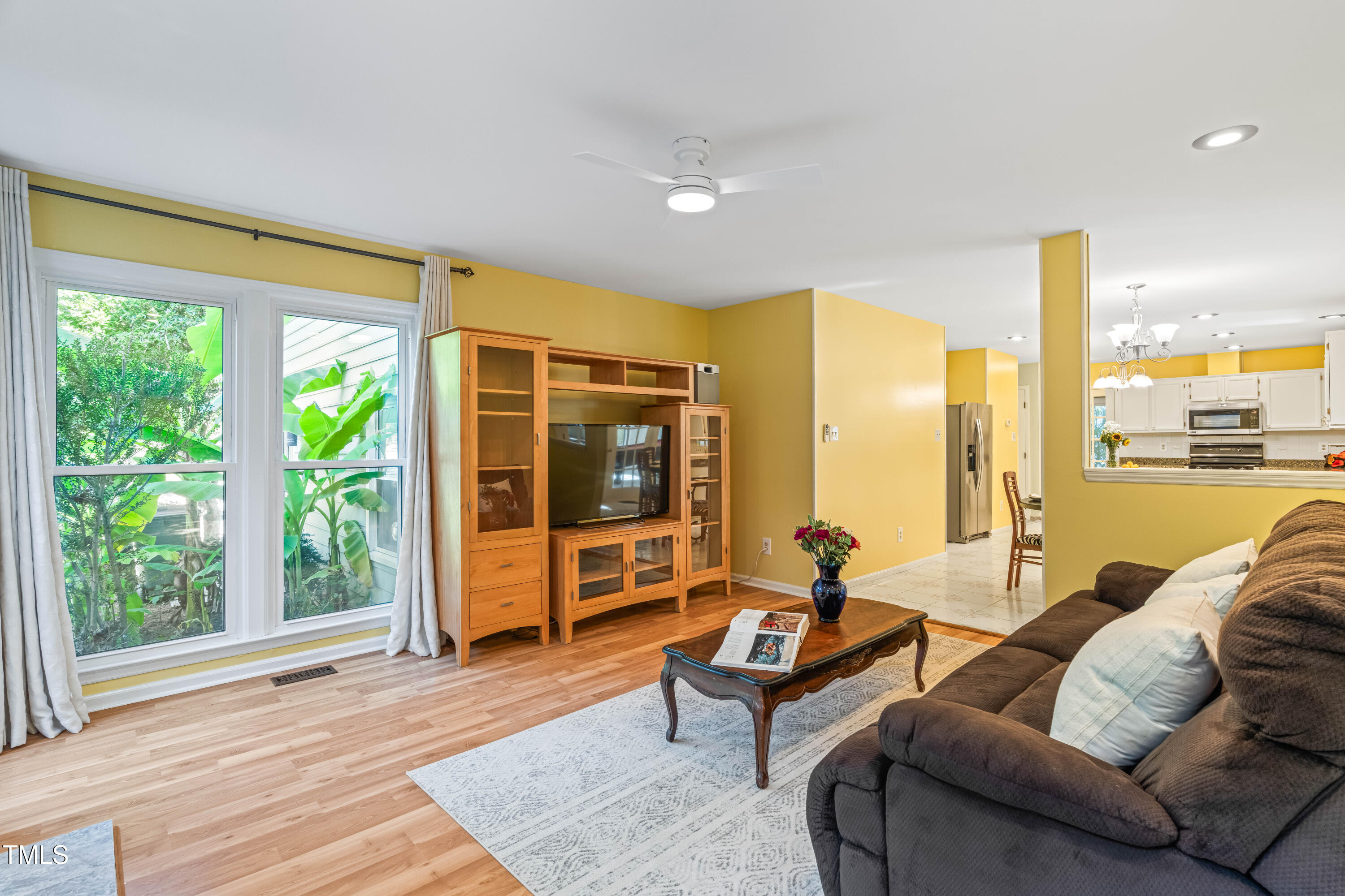 1106 Wellstone Circle Apex, NC 27502 - Photo 23 of 67 a living room with furniture and a window