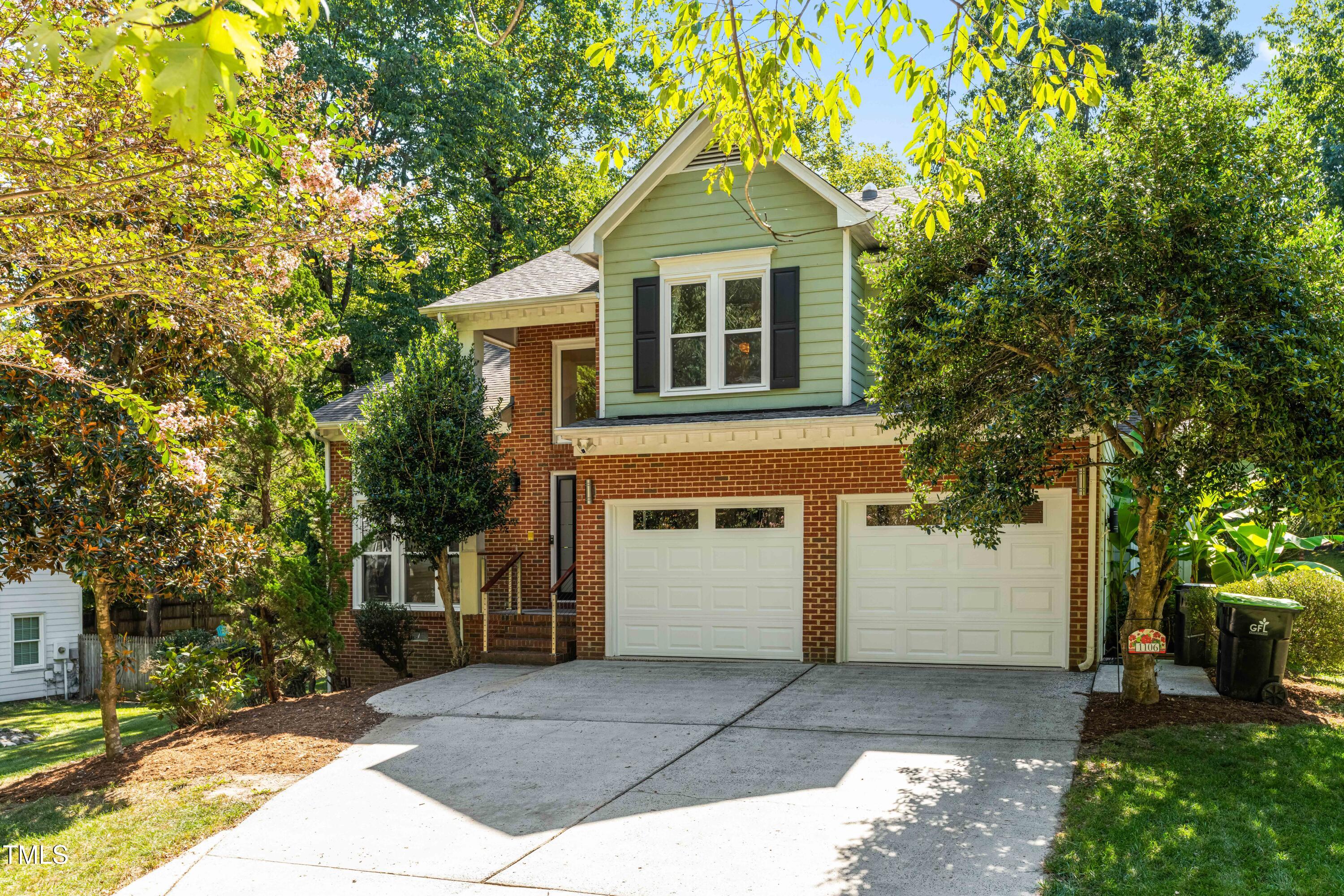 1106 Wellstone Circle Apex, NC 27502 - Photo 3 of 67 a front view of a house with a yard and trees