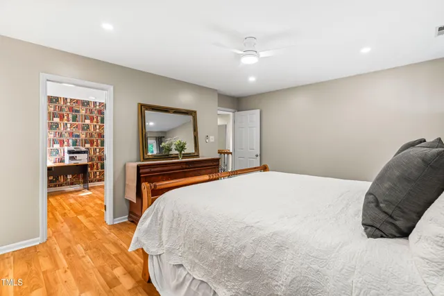 a view of a patio with table and chairs potted plants and large tree