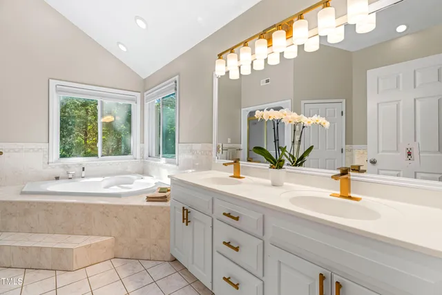 a view of backyard with seating area and trees