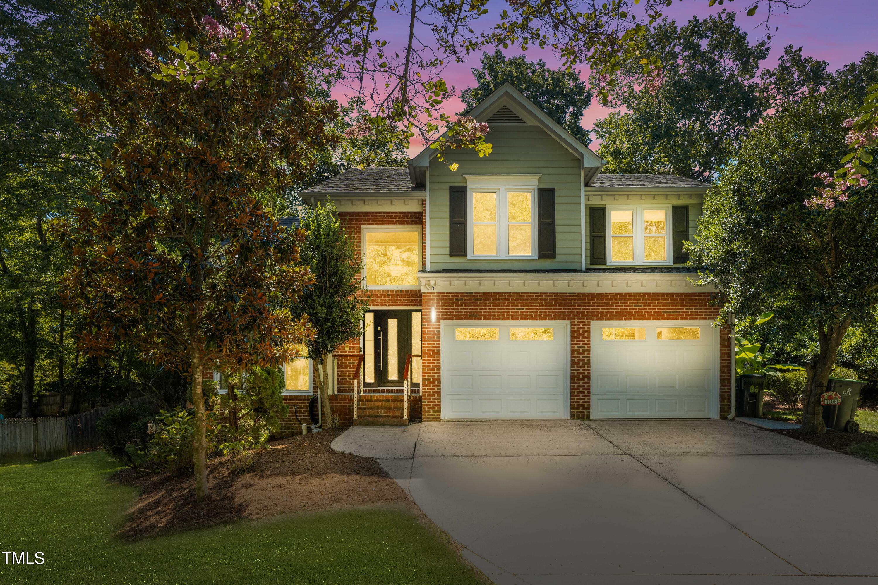 1106 Wellstone Circle Apex, NC 27502 - Photo 4 of 67 a front view of a house with a yard and garage
