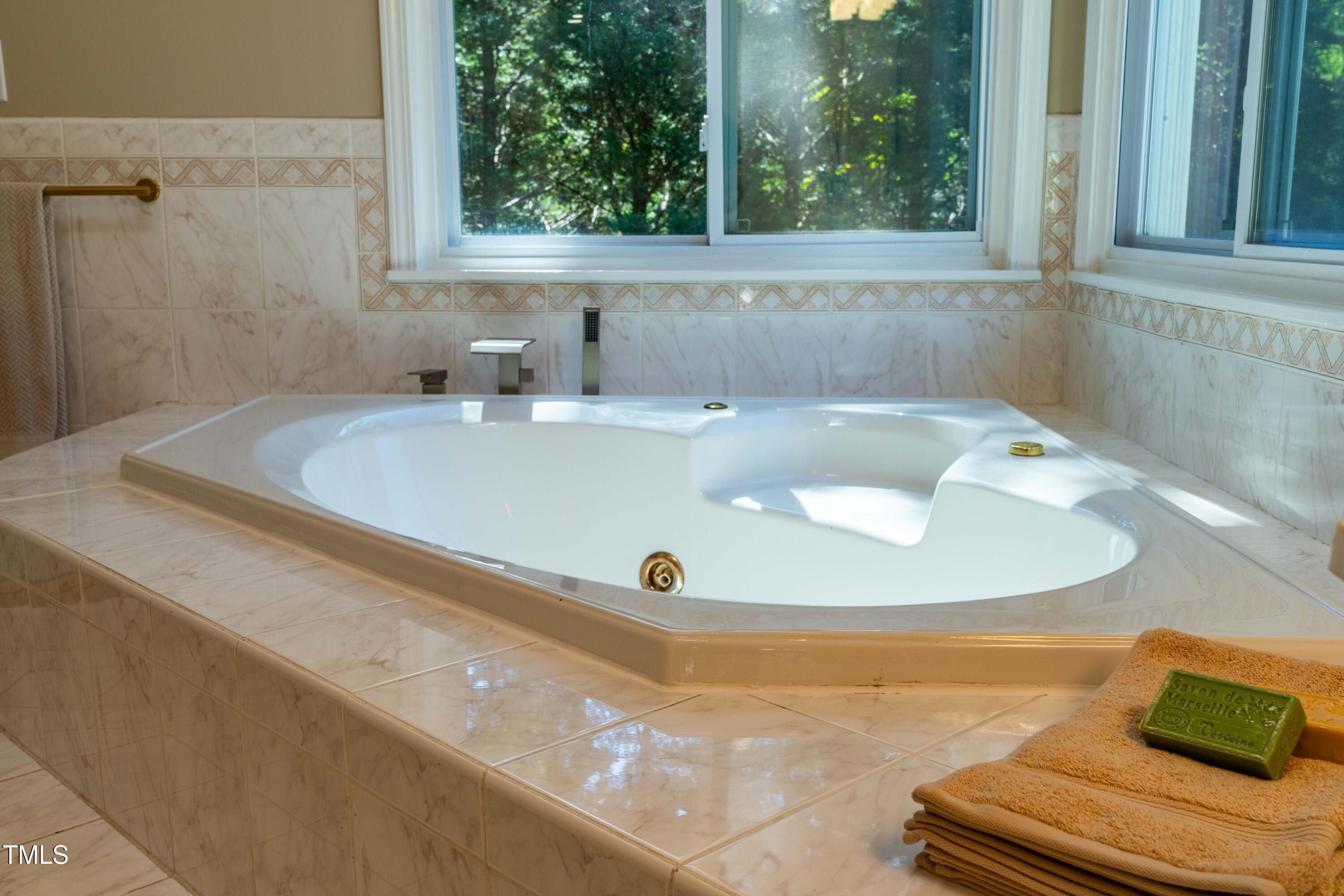 1106 Wellstone Circle Apex, NC 27502 - Photo 42 of 67 a bathroom with a tub