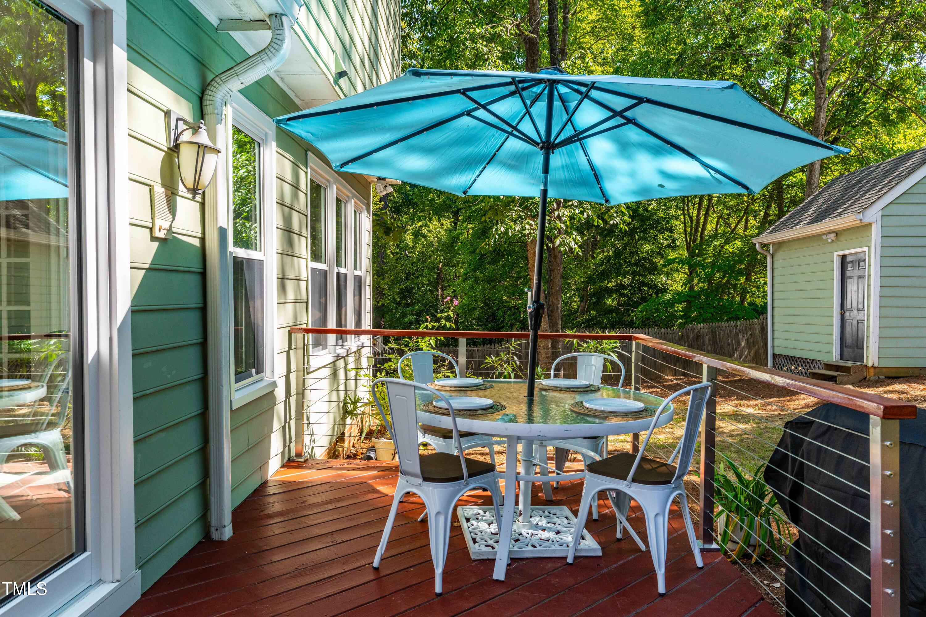 1106 Wellstone Circle Apex, NC 27502 - Photo 53 of 67 a view of deck with furniture and barbeque oven in the backyard