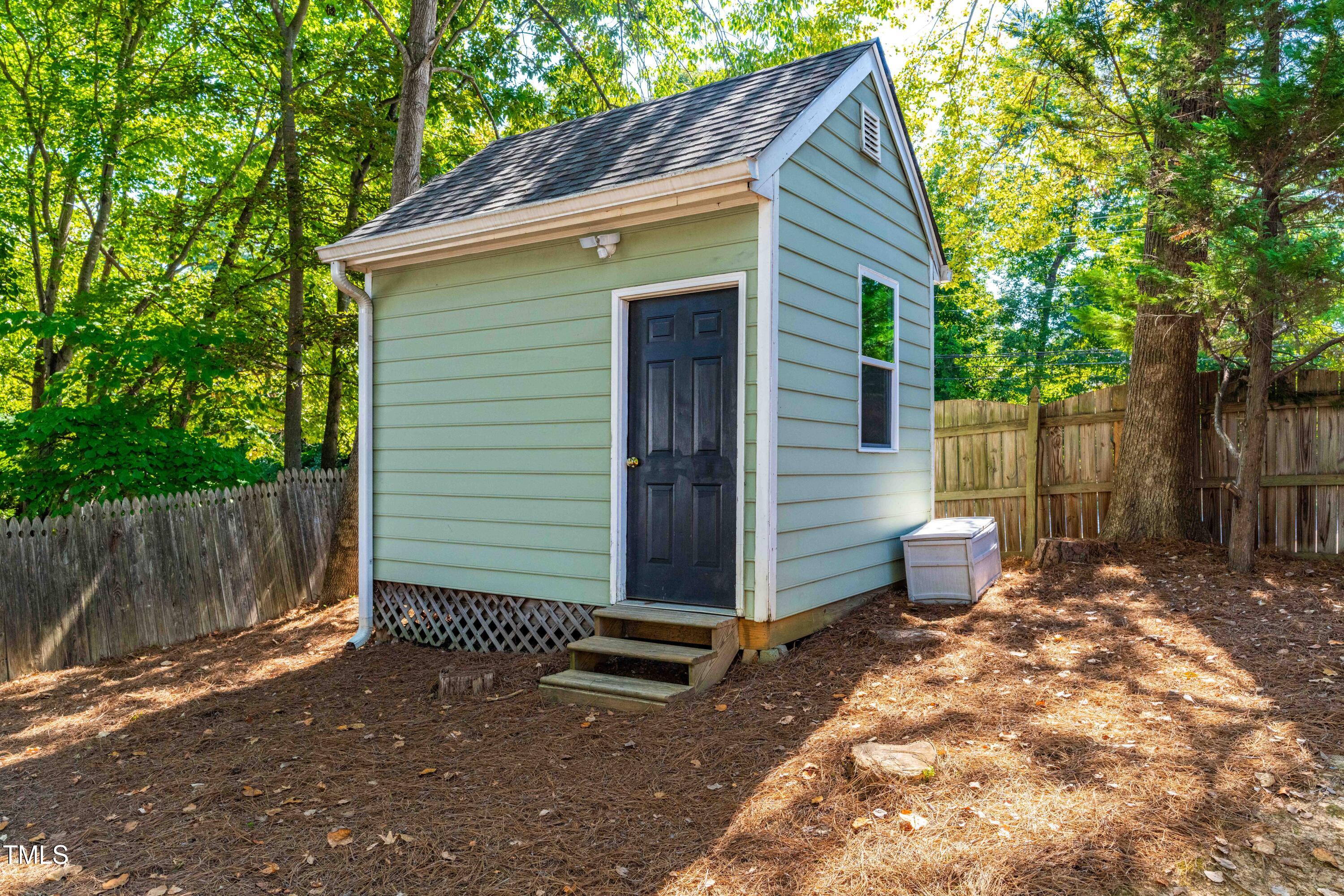 1106 Wellstone Circle Apex, NC 27502 - Photo 58 of 67 a view of a small house with wooden fence