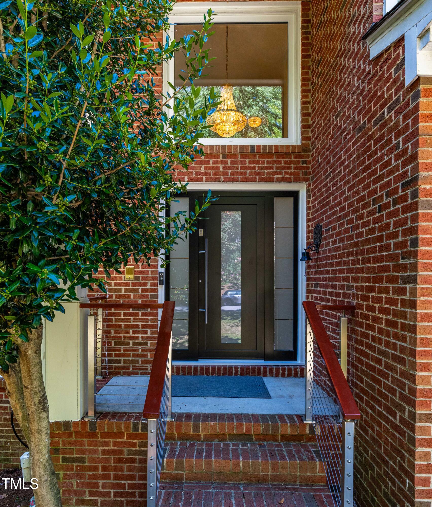 1106 Wellstone Circle Apex, NC 27502 - Photo 6 of 67 a view of a brick building with a large window
