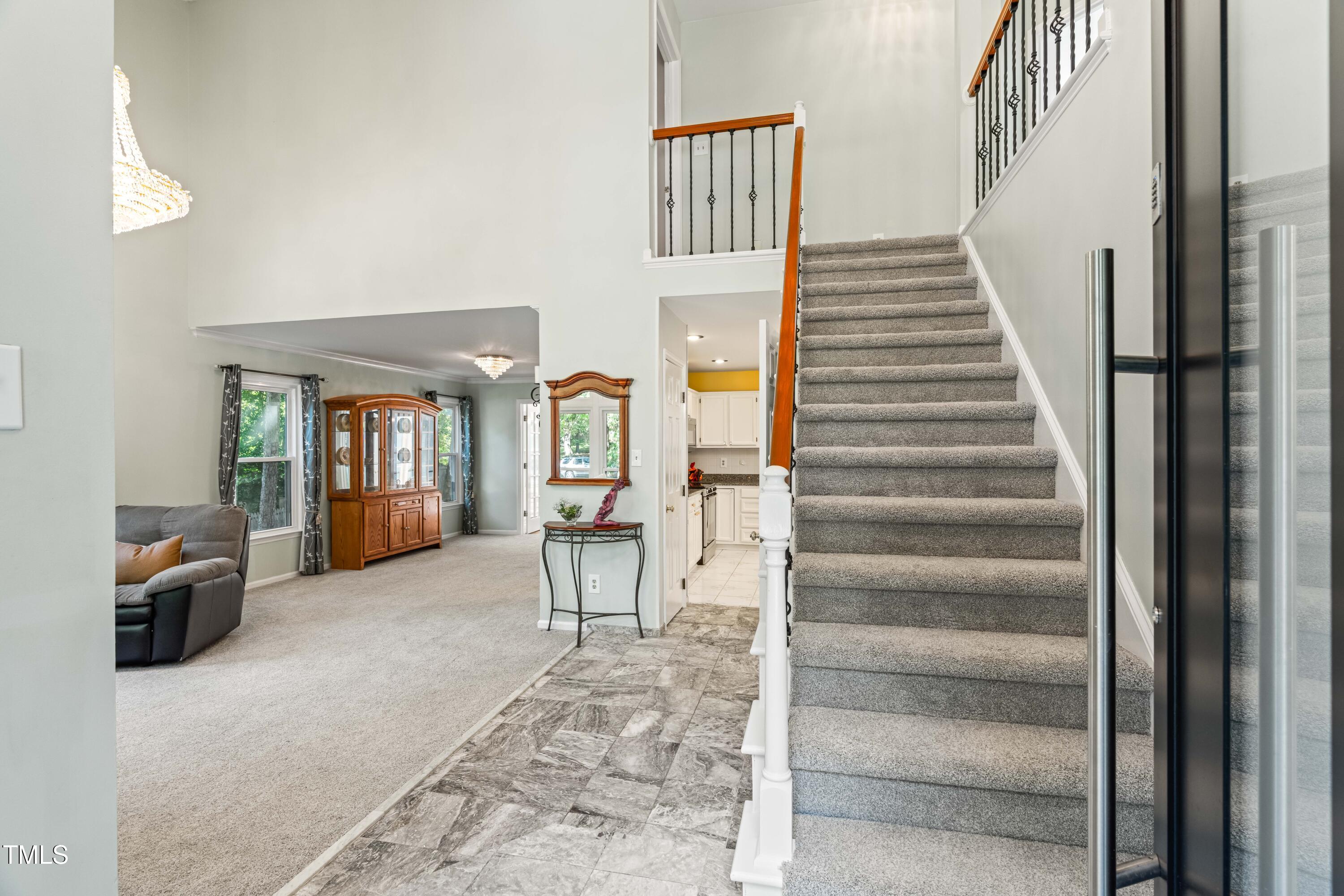 1106 Wellstone Circle Apex, NC 27502 - Photo 8 of 67 a view of a livingroom with furniture and stairs