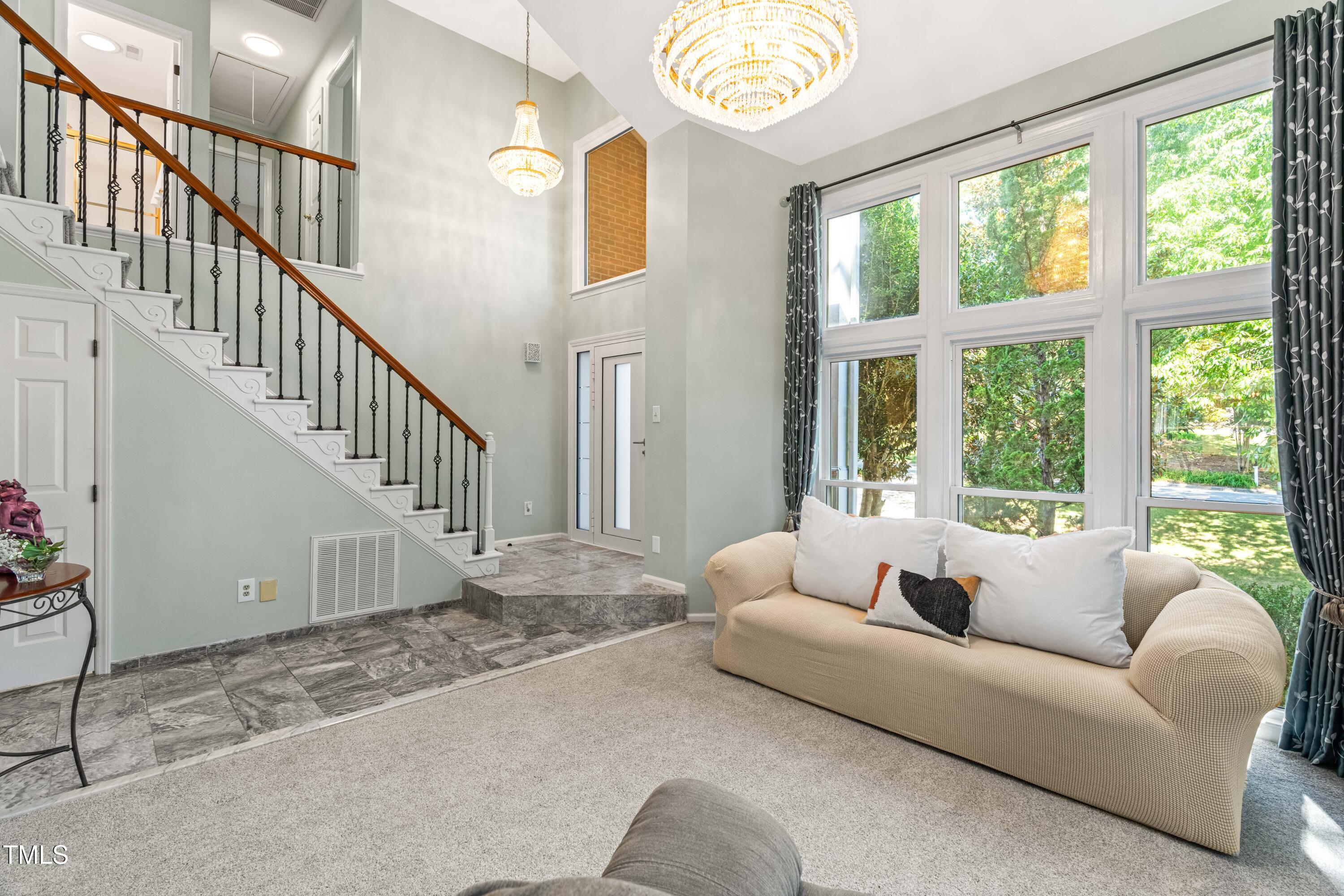 1106 Wellstone Circle Apex, NC 27502 - Photo 10 of 67 a living room with furniture and a large window