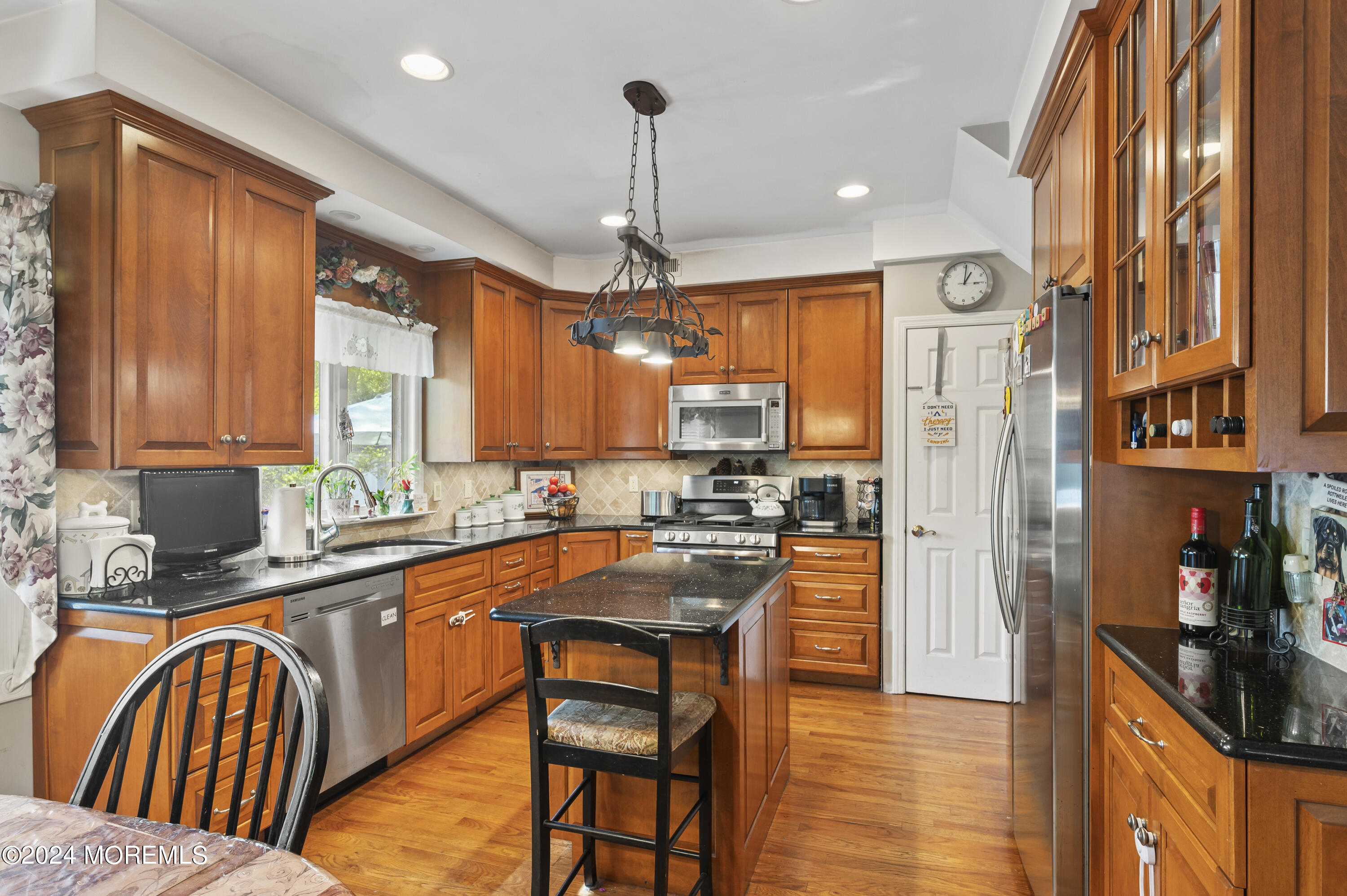 114 Andrew Lane Brick, NJ 08724 - Photo 1 of 54 a kitchen with stainless steel appliances granite countertop a refrigerator a sink dishwasher a stove and white countertops with wooden floor