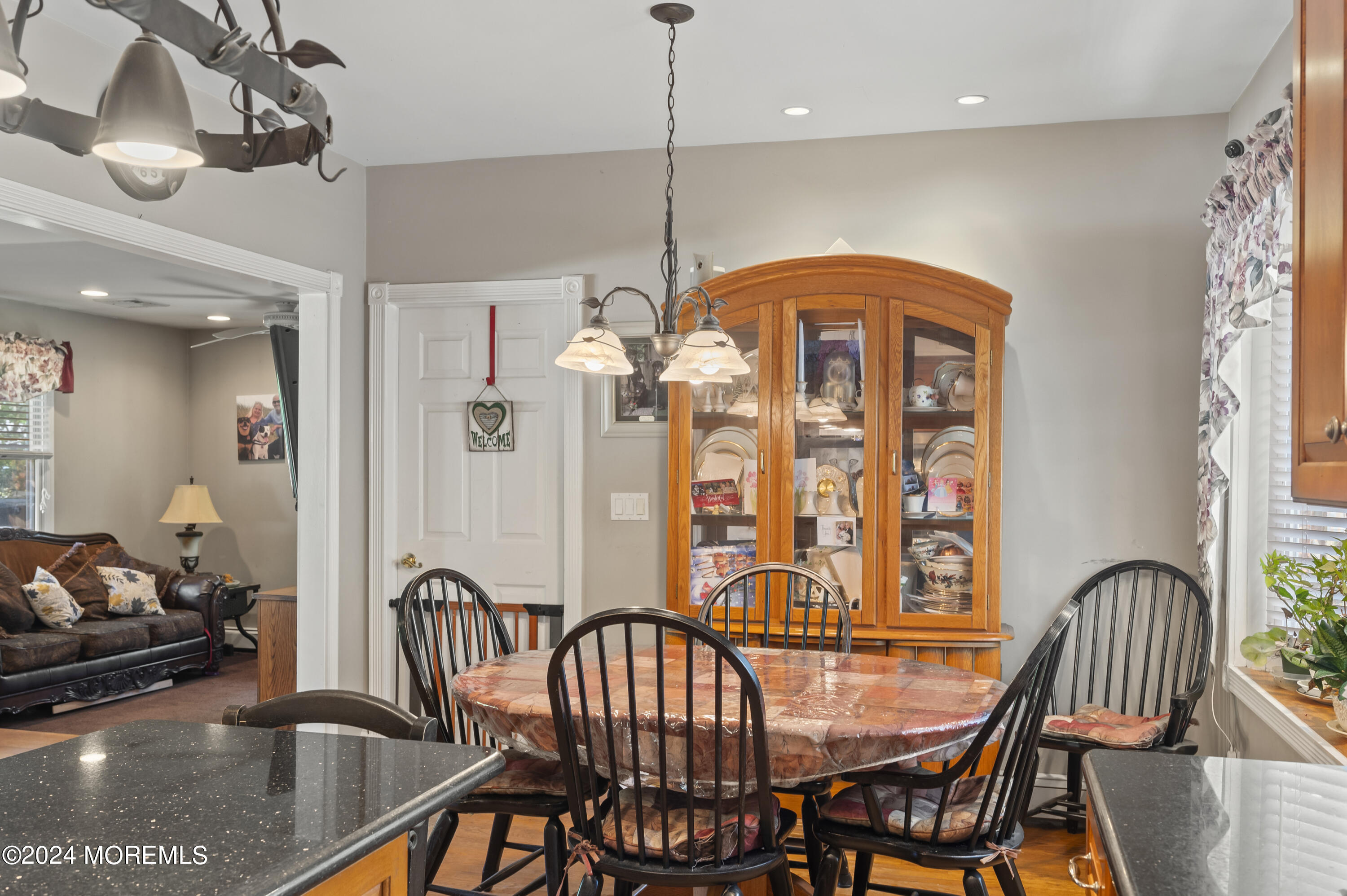 114 Andrew Lane Brick, NJ 08724 - Photo 12 of 54 a view of a dining room with furniture window and wooden floor