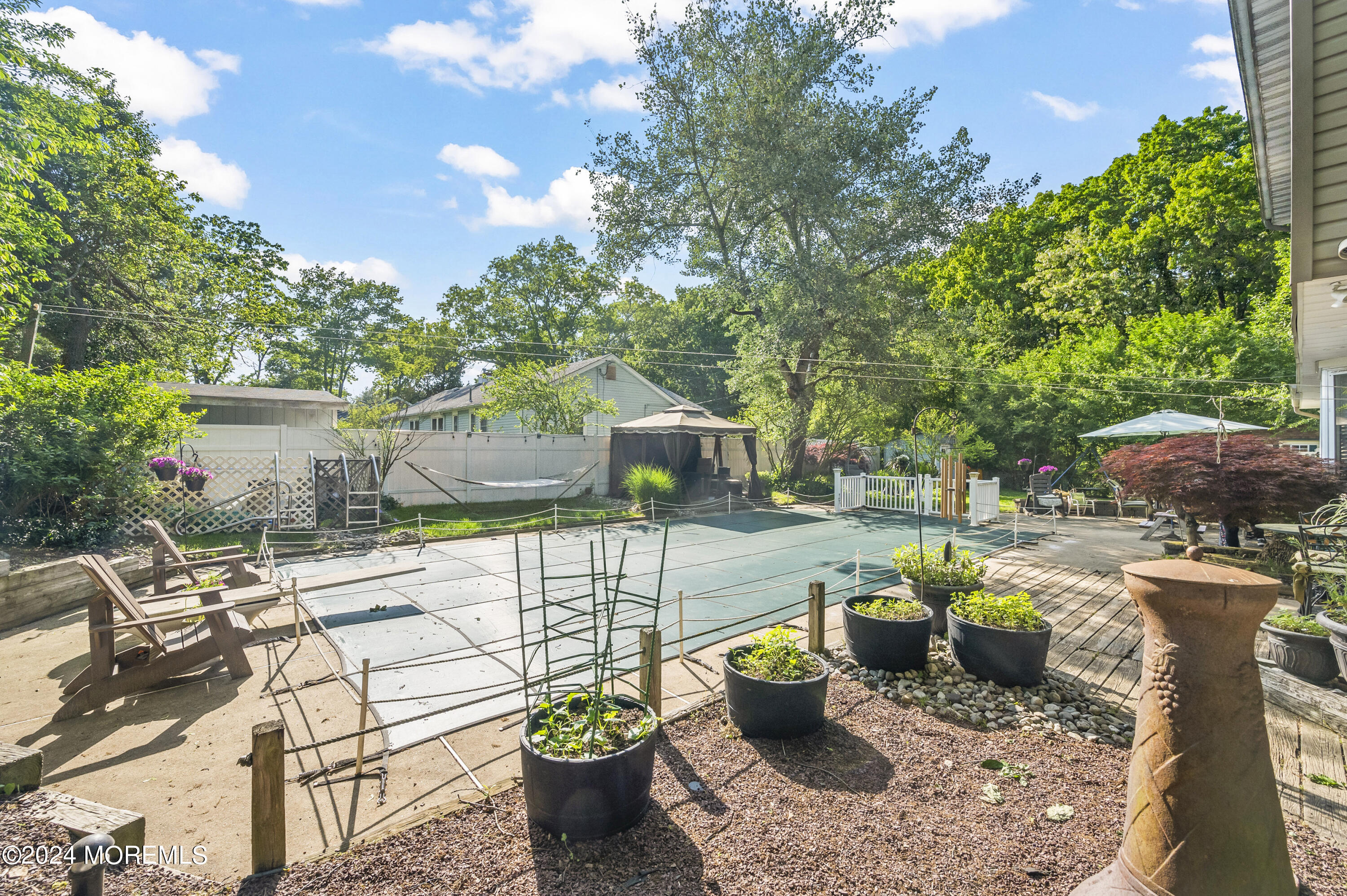 114 Andrew Lane Brick, NJ 08724 - Photo 15 of 54 a view of a patio with couches chairs and potted plants