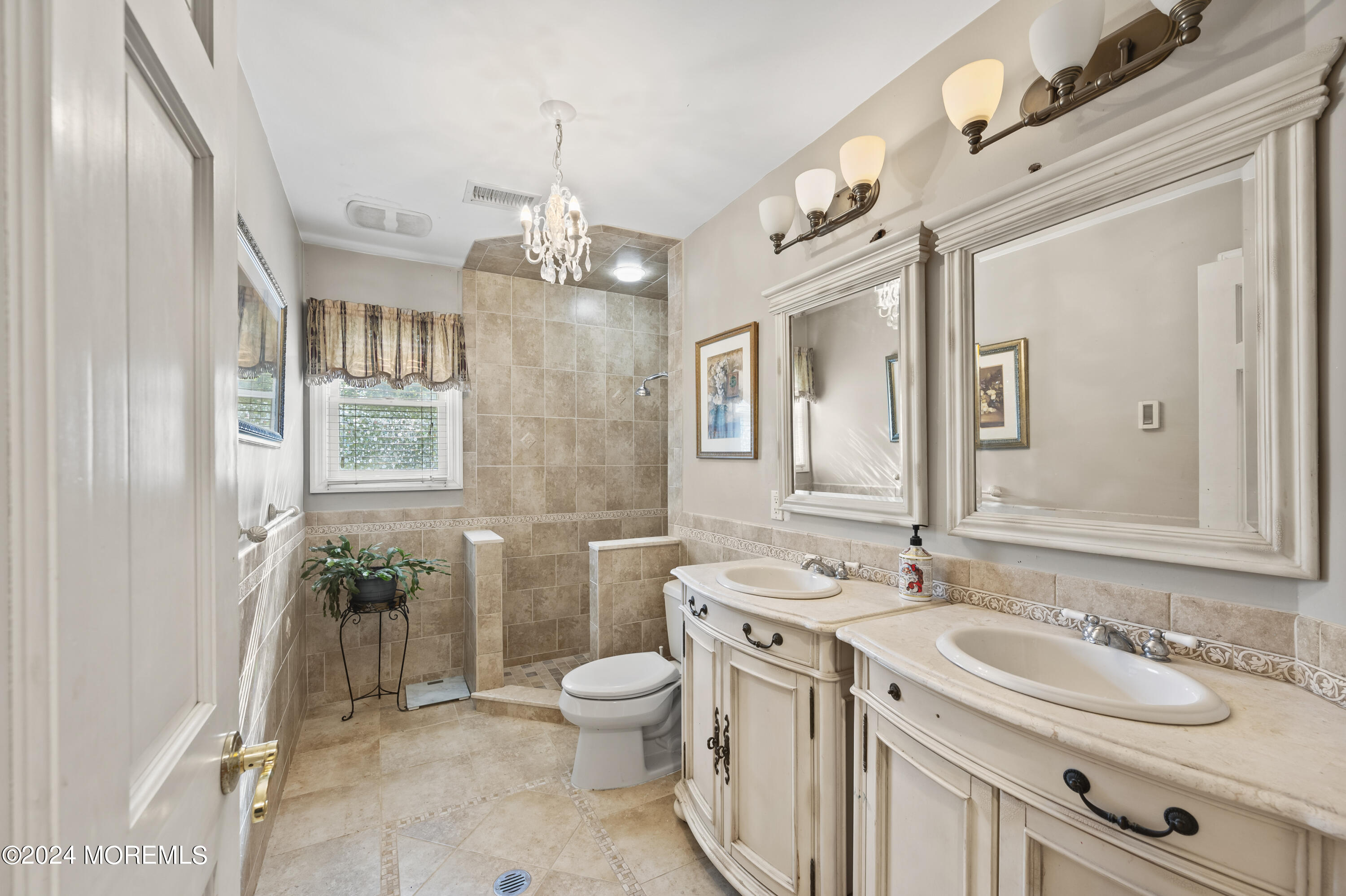 114 Andrew Lane Brick, NJ 08724 - Photo 19 of 54 a spacious bathroom with a granite countertop sink a toilet a mirror and a shower