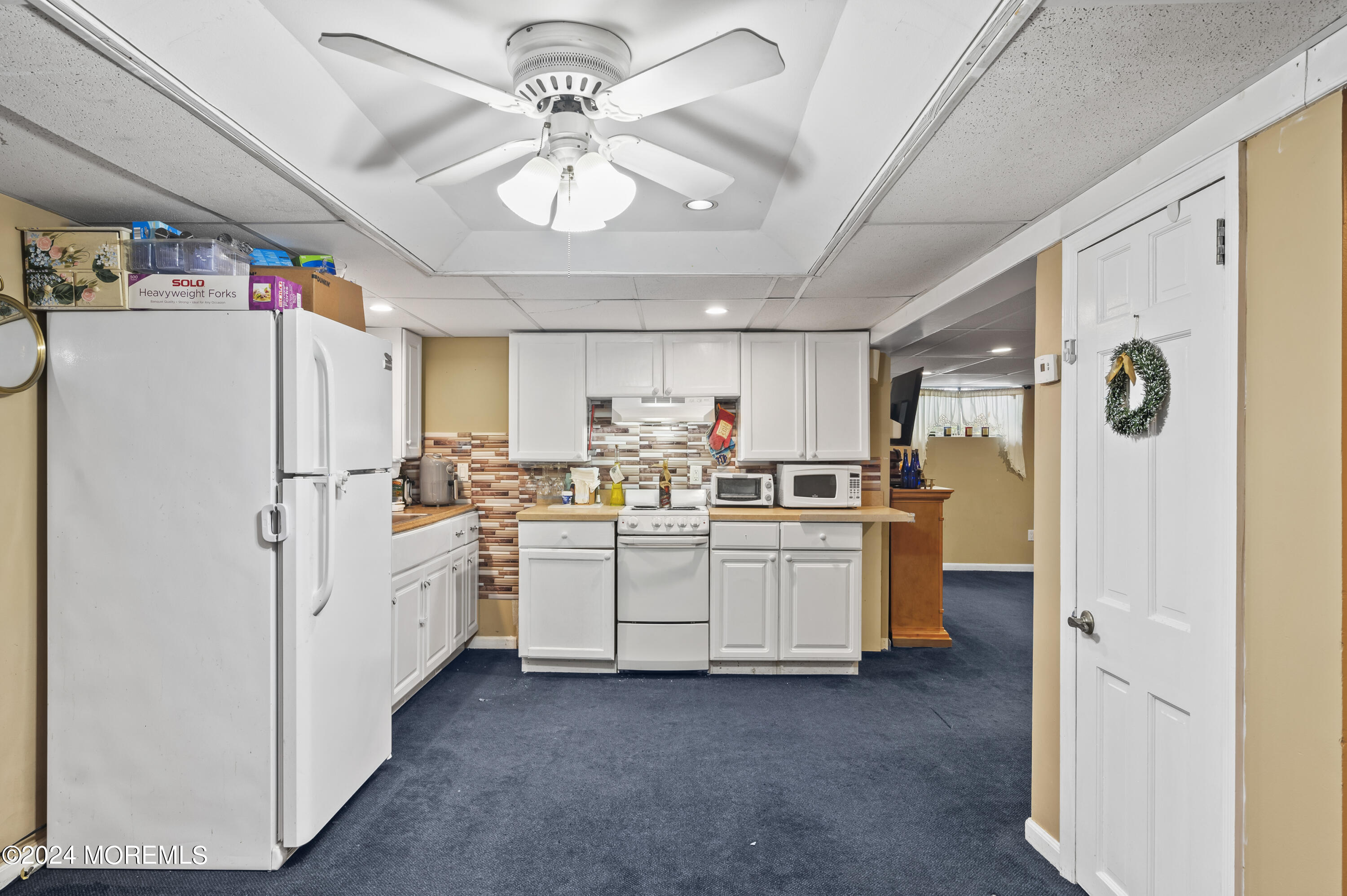114 Andrew Lane Brick, NJ 08724 - Photo 26 of 54 a kitchen with refrigerator a sink and cabinets